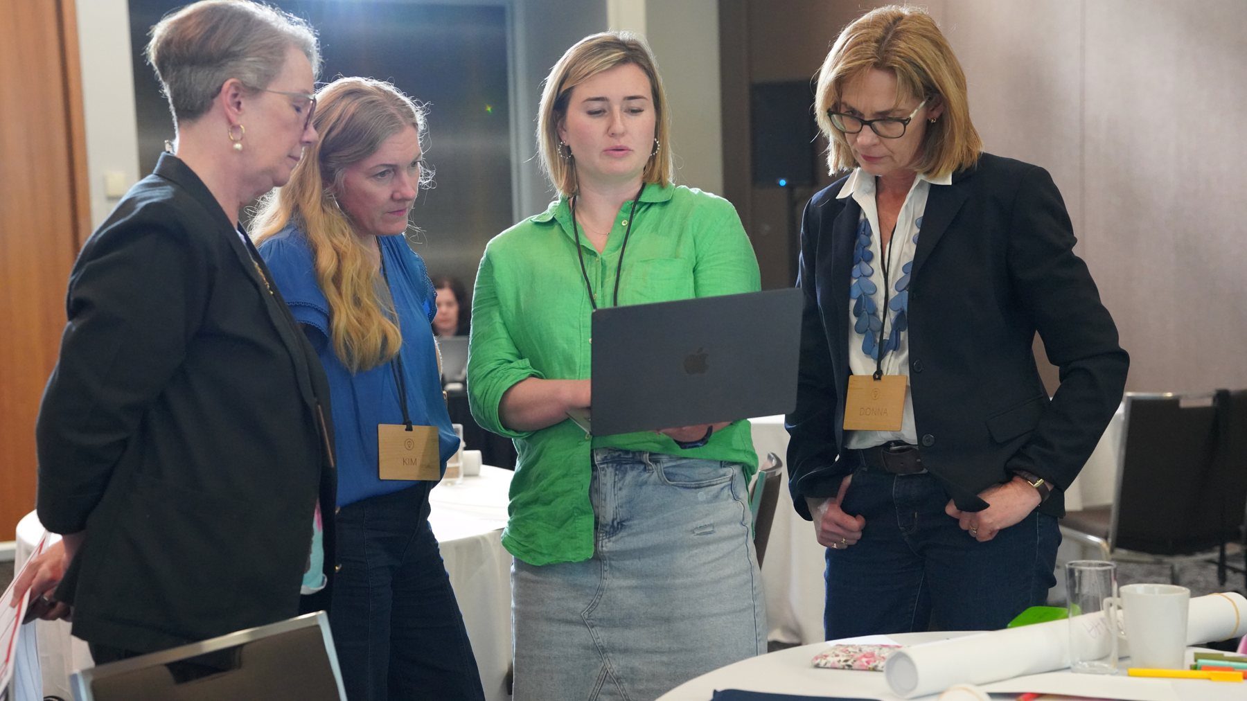 HerBusiness members looking at a plan together on a laptop